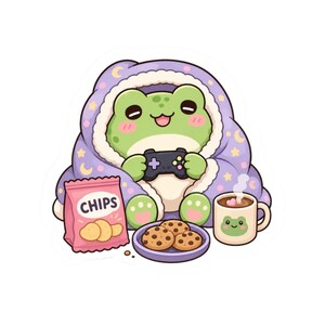 Puede incluir: Un simpático dibujo de una rana con una manta morada con diseños de luna y estrellas, jugando a un videojuego. Una bolsa de patatas fritas, un plato de galletas y una taza de chocolate caliente también están presentes.