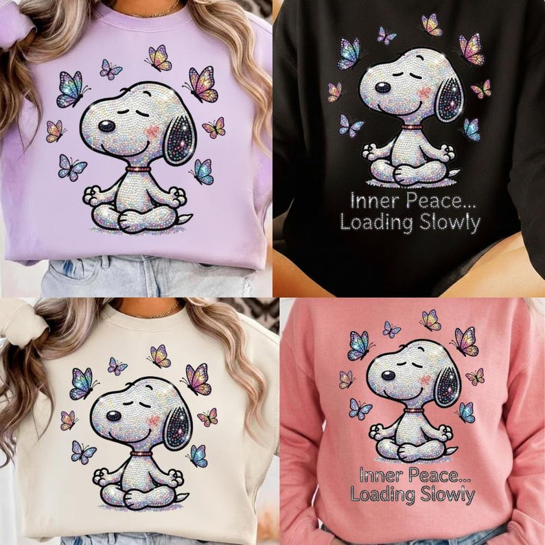 May include: Four sweatshirts in different colors: lavender, black, cream, and pink. Each features a sequined Snoopy meditating with butterflies. The black and pink sweatshirts have the text "Inner Peace... Loading Slowly."