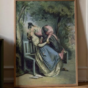 Op de afbeelding: Een ingelijste kunstdruk met een schilderij van twee figuren in historische kleding die elkaar omhelzen op een houten bank in een tuin. De tekst APOLLO TIMELESS PRINTS HIGH QUALITY REPRODUCTIONS is zichtbaar in de linkerbovenhoek.