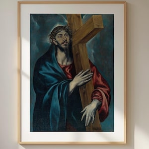 May include: A framed art print featuring a painting of a figure with a crown of thorns, wearing a red garment and a blue cloak, holding a large wooden cross against a dark, cloudy background. The text APOLLO TIMELESS PRINTS is visible.