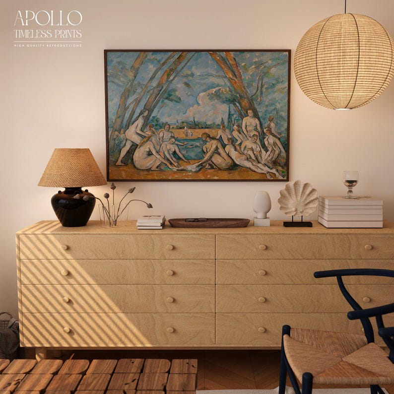 May include: A light wood dresser with six drawers, topped with decorative items and a framed painting. A woven lamp and a paper lantern hang above. The painting depicts figures near water. The text "APOLLO TIMELESS PRINTS" is in the upper left corner.