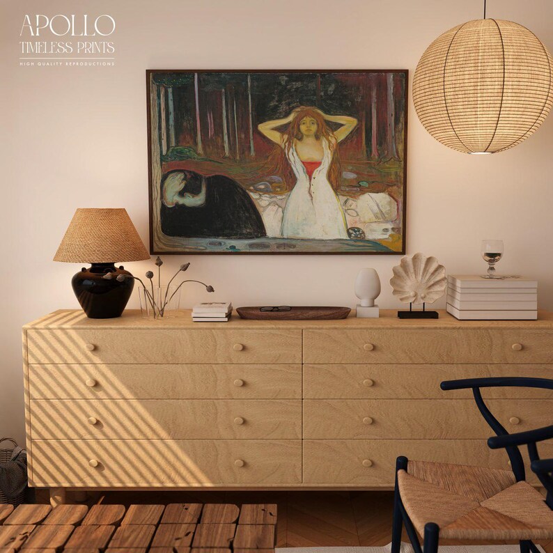 May include: A light wood dresser with six drawers, topped with decorative items and a framed painting. The painting depicts a woman in a white dress with red accents. A woven lamp and a paper lantern hang above.