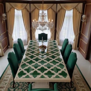 May include: An elegant dining room with a large rectangular table. The table has a white base and a green and white patterned top, surrounded by green velvet chairs. A crystal chandelier hangs above the table, and the room has ornate curtains.