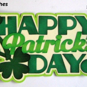May include: Green and white paper craft with the text "Happy St. Patrick's Day!" and shamrock designs. The craft measures 15.9 x 8.3 cm.