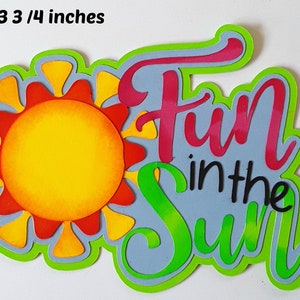 May include: A green, blue, yellow, and red layered paper craft with the words "Fun in the Sun" in black text. The craft is 5 x 3 3/4 inches.