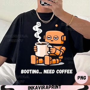 May include: Black t-shirt with a cartoon robot design. The orange robot is holding a coffee mug, with binary code above. The text reads "BOOTING... NEED COFFEE". The robot's expression suggests tiredness and a need for a caffeine boost.