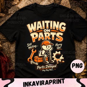 May include: A black short-sleeved t-shirt featuring a graphic of a stick figure sitting on a toolbox with the text "WAITING ON PARTS", "Still Waiting...", "Hurry Up!", "Parts Delayed", and "Any Day Now..." alongside a wrench, bolt, and gear.