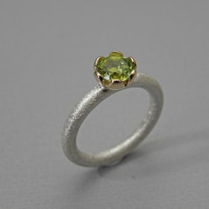 Peridot solitaire ring in silver and gold