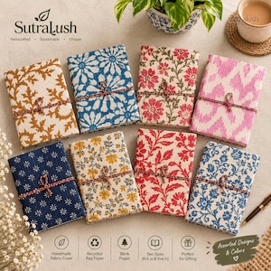 May include: Eight rectangular journals with fabric covers featuring various floral and botanical patterns in blue, yellow, pink, and brown. Each journal is tied with a thin, dark brown cord. The journals are arranged in two rows on a light surface.