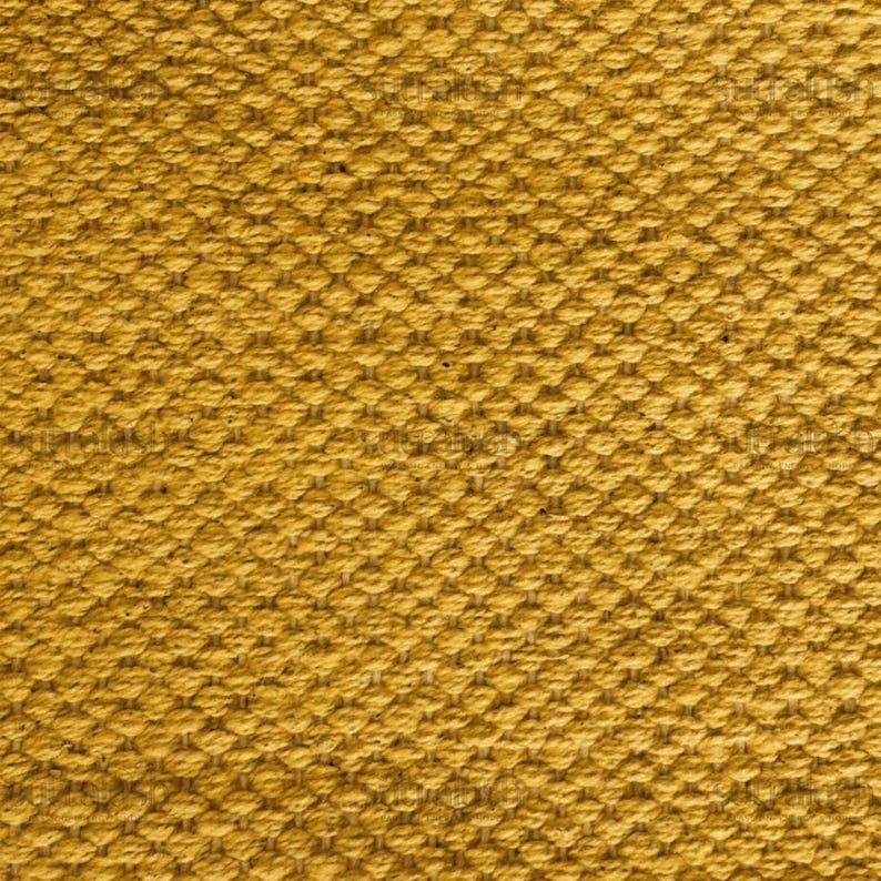 May include: Close-up of a textured fabric in a golden yellow color. The weave pattern is visible, creating a raised, grid-like texture. The fabric appears to be tightly woven, suggesting durability and a sturdy construction. The overall look is warm and inviting.