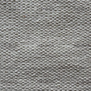 Peut inclure: Gros plan sur un tissu textur&eacute; gris clair. La surface est recouverte de petites bosses en relief, cr&eacute;ant un motif tactile et visuellement int&eacute;ressant. Le tissu semble &ecirc;tre tiss&eacute; serr&eacute;, sugg&eacute;rant une durabilit&eacute;.