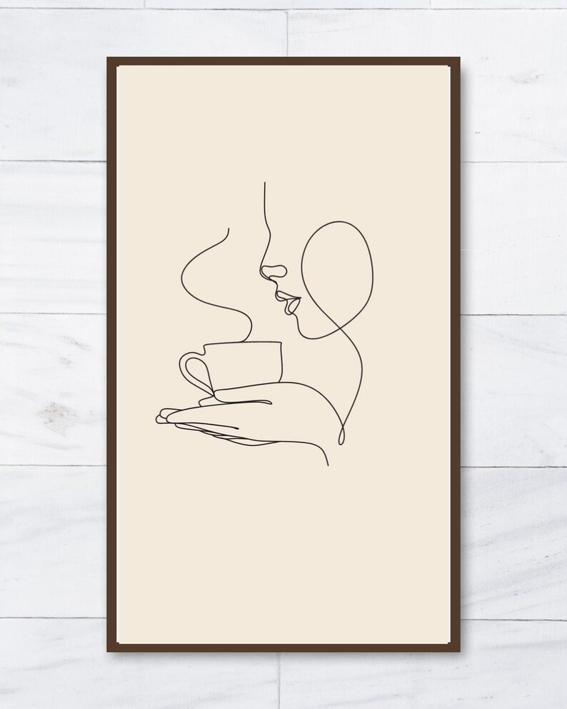 K&ouml;nnte beinhalten: Gerahmter Kunstdruck mit einer minimalistischen Strichzeichnung eines Personenprofils, das eine Kaffeetasse h&auml;lt. Die schwarze Linienkunst befindet sich vor einem beigefarbenen Hintergrund, in einem dunkelbraunen Rahmen. Der Dampf aus der Kaffeetasse ist ebenfalls dargestellt.