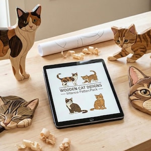 May include: Wooden cat figurines and a cat face wall hanging are displayed on a wooden surface. A tablet shows cat designs with the text "Wooden Cat Designs - Intarsia Pattern Pack". The cats are in various poses and colors.