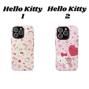 May include: Two phone cases featuring Hello Kitty designs. The first case is light beige with Hello Kitty, cherries, and bows. The second case is pink with Hello Kitty and a teddy bear, plus a heart-shaped graphic.