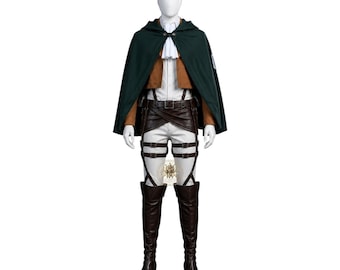May include: A cosplay costume featuring a dark green hooded cape, a tan cropped jacket, a white collared shirt with a cravat, white trousers, and brown leather-look harness straps. The ensemble includes dark brown knee-high boots and a belt.