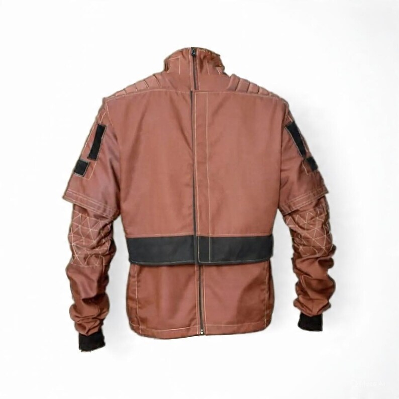 May include: A brown jacket with black accents and a high collar. The jacket features a zipper closure, quilted sleeves, and black patches on the upper arms. The back of the jacket is visible, showcasing the design and stitching details.