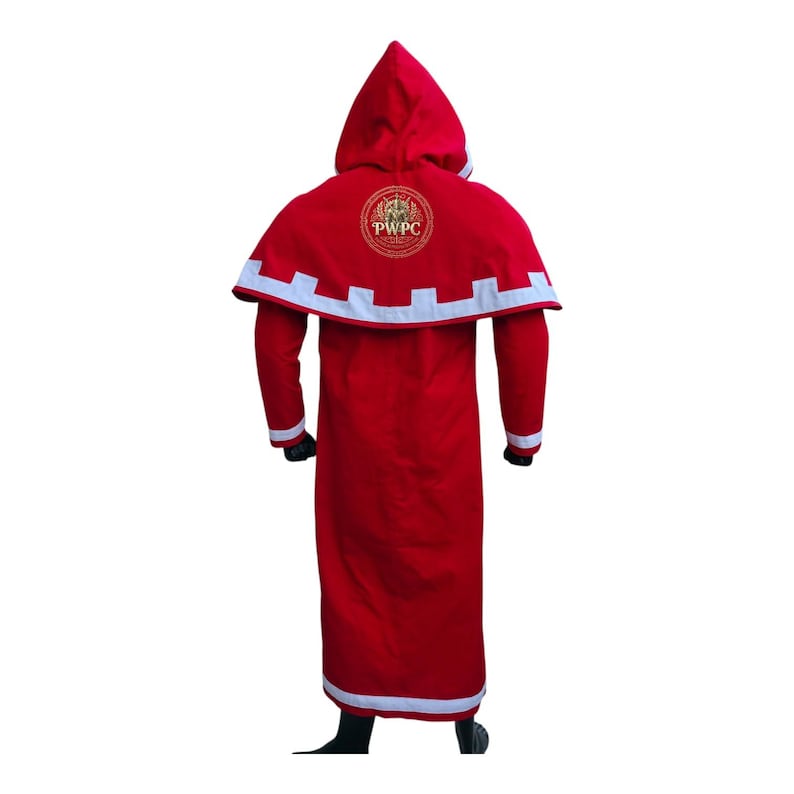 May include: A red hooded robe with white trim and a circular emblem on the back. The robe has long sleeves and a floor-length design. The emblem features the letters "PWPC" in a gold color.
