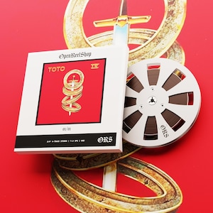 May include: A white box with the text "TOTO" on a red background, accompanied by a gold emblem and a reel-to-reel tape. The box reads "OpenReelShop" and "ORS". The background is red with gold accents.