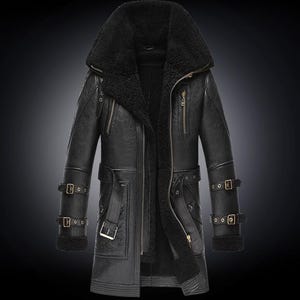 May include: Black leather coat with a large shearling collar and lining. The coat features multiple pockets, a zipper closure, and adjustable buckle straps on the sleeves and waist. The coat is designed for cold weather.