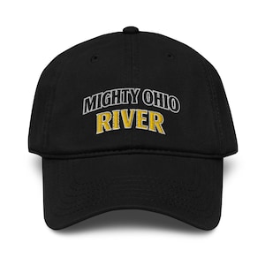 May include: Black baseball cap with the embroidered text "MIGHTY OHIO RIVER" in white and gold. The cap has a curved brim and a button on top. A casual accessory for outdoor activities.