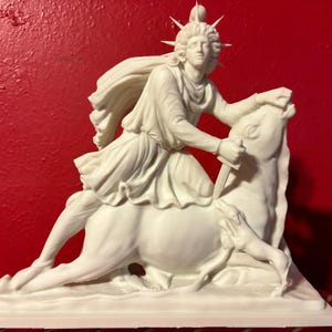 May include: A white sculpture of a figure riding a horse, holding a knife. The figure is draped and crowned. A dog is at the horse's feet. The sculpture sits on a white rectangular base.