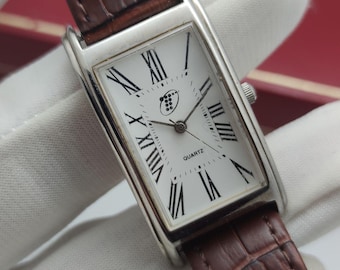 Vintageklocka T Curvex Tankklocka Quartzläge Frankrike Chiffre Roman Herr 70-tal