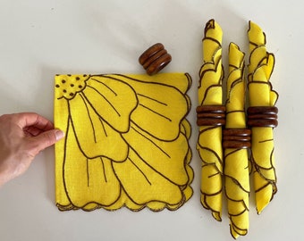 Set of Four Yellow Cloth Napkins with Wooden Napkin Rings