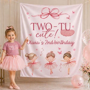 May include: A little girl in a pink tutu and t-shirt stands in front of a pink banner. The banner reads "TWO-TU cute! Olivia's 2nd birthday" with illustrations of ballerinas, butterflies, and stars. Pink balloons and flowers are also present.
