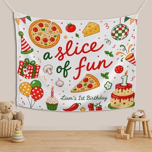 May include: A white fabric wall hanging featuring the red and green text a slice of fun and Liam's 1st Birthday. The design includes illustrations of a whole pizza, a pizza slice, a birthday cake with a number one candle, a gift, and balloons.
