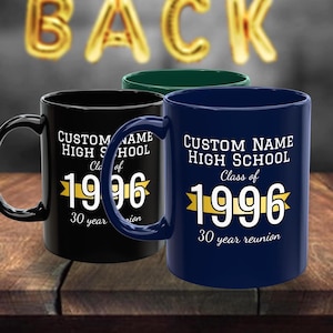 May include: Three ceramic mugs in black, dark blue, and dark green. Each mug features white text reading CUSTOM NAME HIGH SCHOOL, Class of 1996, and 30 year reunion, centred around a yellow banner graphic with the year 1996 in large white font.