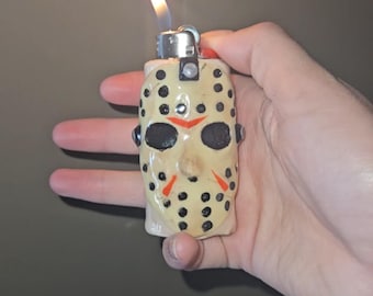 Jason mask lighter case: heavy duty lighter sleeve with metal insert for scary movie lovers