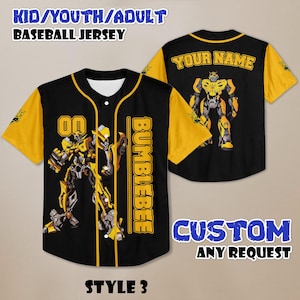 May include: Black and yellow baseball jersey with a Bumblebee graphic. The jersey has short sleeves and a button-up front. The text "YOUR NAME" is on the back. The jersey is available in youth and adult sizes.