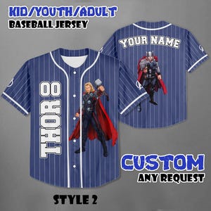May include: Blue baseball jersey with white pinstripes, featuring a Thor graphic and the text "THOR 8". The back of the jersey has a Thor graphic and the text "YOUR NAME". The text "KID/YOUTH/ADULT BASEBALL JERSEY" is at the top.