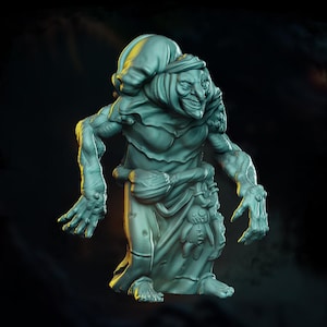 May include: A detailed, teal-colored figurine of a witch with a sinister grin, wearing a pointed hat and a long dress. The witch has long, gnarled fingers and a small doll hanging from her waist. The figure is set against a dark background.