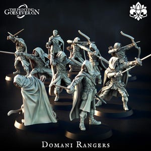 May include: A collection of miniature figures of Domani Rangers, each in a dynamic pose. The figures are clad in hooded cloaks and tunics, some wielding swords, others bows. The text "THE PRINTING GOES EVER ON" and "Domani Rangers" are visible.