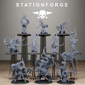 May include: A selection of grey fantasy miniatures, featuring tentacled and winged creatures, presented on black stands. The word "STATIONFORGE" is displayed above, with a skull and wings logo. The figures are of varying sizes and poses, creating a dynamic display.
