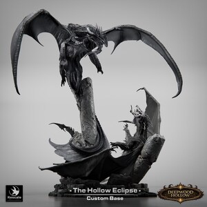 May include: A detailed grayscale sculpture of two dragons in a dynamic pose. One dragon is perched atop a stone pillar, wings spread, facing another dragon below. The base reads "The Hollow Eclipse - Custom Base" and the Deepwood Hollow logo.