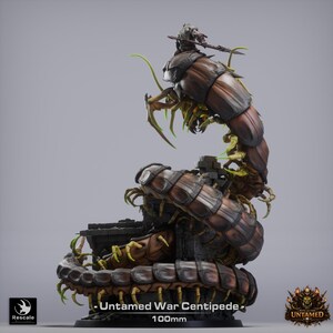 May include: A detailed miniature of an "Untamed War Centipede" with a rider. The model is primarily brown and black, with green accents. The centipede has multiple legs and segments, and the rider is armed. The base is 100mm.