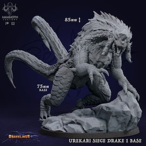 May include: A detailed gray Urekari Siege Drake 1 Base miniature, with a 75mm base and 85mm height. The creature is posed on a rocky base, showcasing intricate textures and a menacing design. The Mammoth Factory and Drakklings logos are visible.