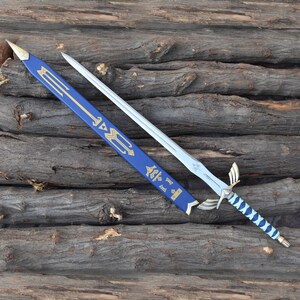 May include: A silver sword with a blue and gold handle and a matching blue sheath. The sword has a decorative hilt and a blade with a star-like design. The sheath has gold accents and symbols.