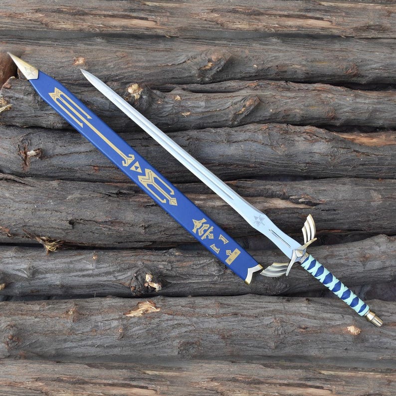 May include: A silver sword with a blue and gold handle and a matching blue sheath. The sword has a decorative hilt and a blade with a star-like design. The sheath has gold accents and symbols.