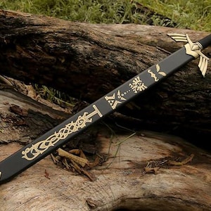 May include: A black sword with gold detailing, featuring ornate patterns and a decorative hilt. The blade rests on a weathered log, highlighting the details of the fantasy weapon. The sword's design includes a gold emblem on the blade.