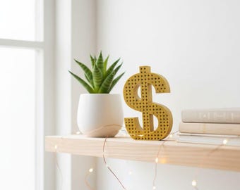 Hucha con símbolo de dólar impresa en 3D a mano