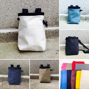 May include: A set of nine different colored drawstring bags. The bags are made of a canvas material and have a black drawstring closure. The bags are all different colors, including blue, green, red, yellow, and brown.