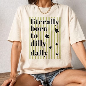 May include: A set of three ceramic mugs with a speckled, matte finish. Each mug features a different color: light blue, cream, and gray. The mugs have a simple, modern design and a comfortable handle.