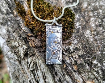 Curls and swirls with orange crystal in sterling silver