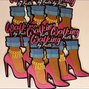 May include: A collection of embroidered patches featuring a high-heeled shoe in bright pink, blue cuffed denim, and a gold ankle chain with the word FAITH. Each patch displays the text Walking by Faith in a pink script font with black outlines.