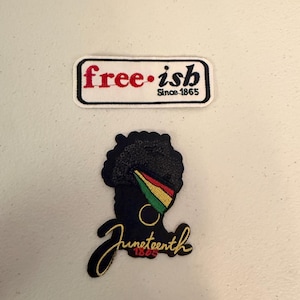 May include: Two embroidered patches. The top patch reads "free-ish Since 1865" in red and black. The bottom patch features a black silhouette of a person with a head wrap in the colors of the Pan-African flag, with the word "Juneteenth 1865" in gold script.