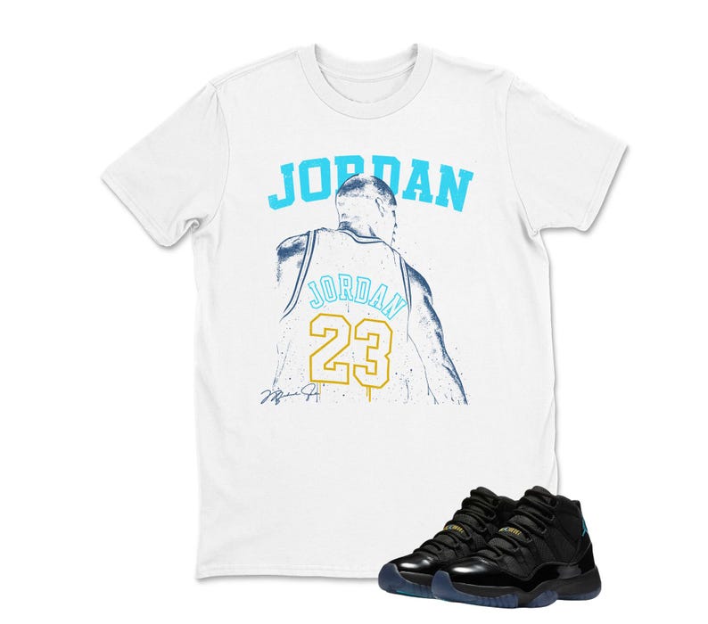 May include: White t-shirt with the word "JORDAN" in light blue and a graphic of a basketball player's jersey with the number 23. Black and blue athletic shoes are at the bottom of the image.