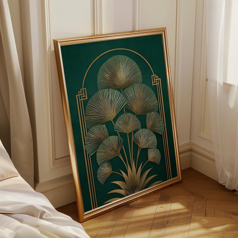 May include: A framed art print featuring a botanical design. The artwork showcases a dark green background with gold-colored fan-shaped leaves and geometric accents. The frame is gold-colored, adding to the art deco style.